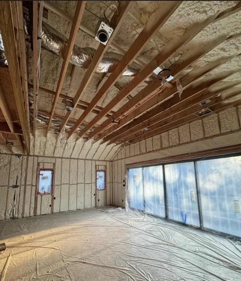 Interior walls and ceiling insulated with spray foam during new construction in New Kensington